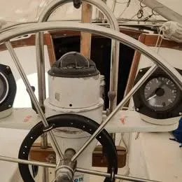 Slide: The Image of Steering wheel of a 1984 Catalina Sloop sailboat with navigation instruments. - 10