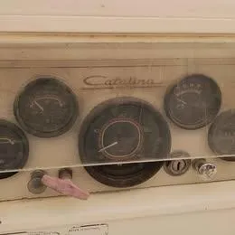 Slide: The Image of Dashboard of a 1984 Catalina Sloop with vintage gauges and controls. - 7