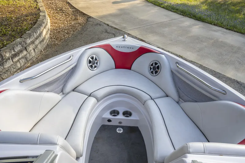 Slide: The Image of 2007 Correct Craft Air Nautique 226 LE boat interior with white and red seating. - 10