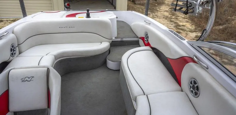 Slide: The Image of 2007 Correct Craft Air Nautique 226 LE interior with white and red seating, spacious layout. - 11