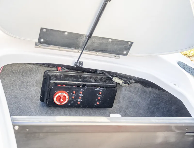 Slide: The Image of 2007 Correct Craft Air Nautique 226 LE storage compartment with control panel. - 14