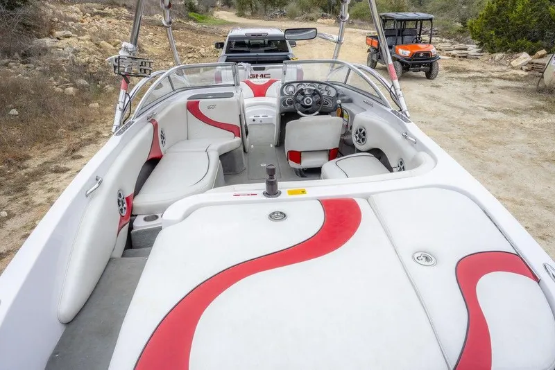 Slide: The Image of 2007 Correct Craft Air Nautique 226 LE boat interior with red and white seating. - 4