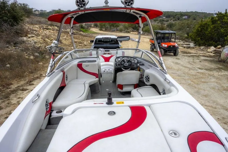 Slide: The Image of 2007 Correct Craft Air Nautique 226 LE boat interior with red and white seating. - 5