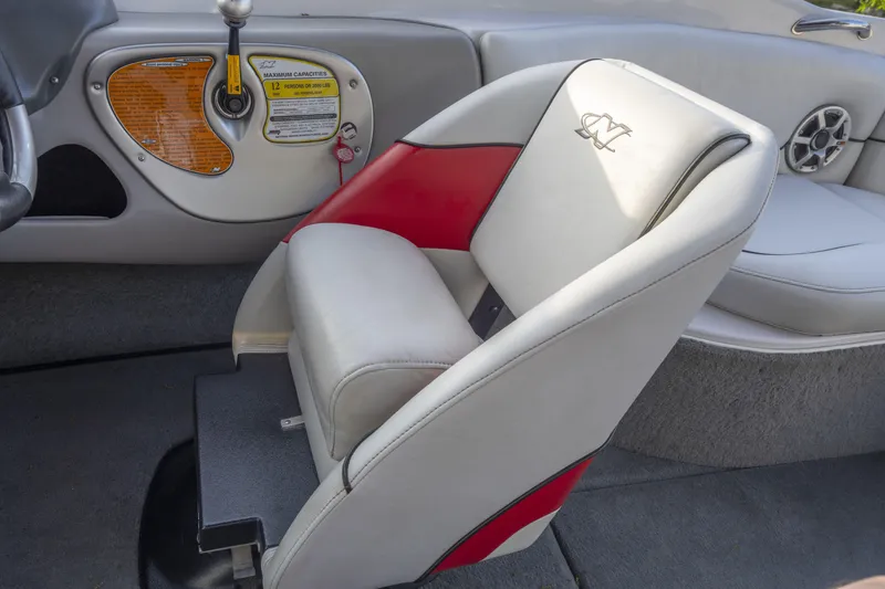 Slide: The Image of 2007 Correct Craft Air Nautique 226 LE interior with red and white seating. - 9