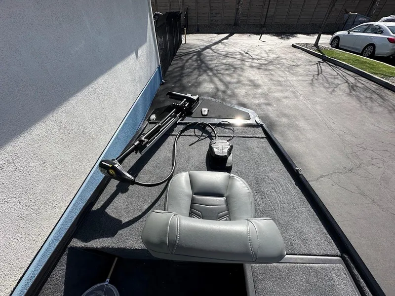 Slide: The Image of 2021 Tracker Bass Tracker Classic XL boat with gray seating and trolling motor. - 20
