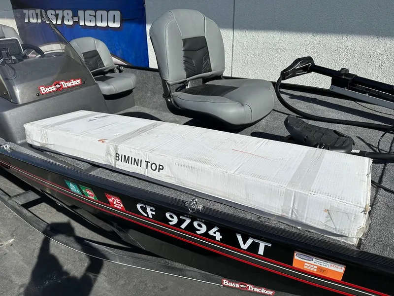 Slide: The Image of 2021 Tracker Bass Tracker Classic XL with packaged Bimini top on deck. - 24