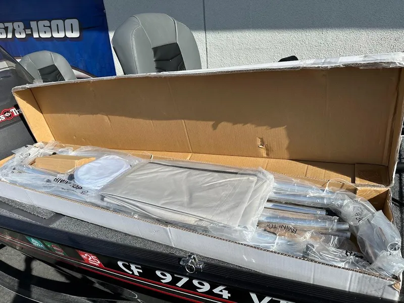 Slide: The Image of 2021 Tracker Bass Tracker Classic XL boat with packaged accessories on deck. - 25