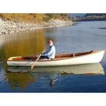 Slide: The Image of Man rowing a 2016 Custom Cedar Strip boat on a calm lake. - 11