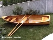 Slide: The Image of Custom cedar strip boat with oars on grass, built in 2016. - 8