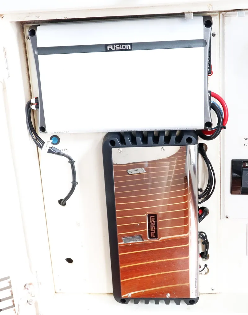 Slide: The Image of Sunseeker Predator 74 yacht, 2000 model, docked with blue sunpad cover. - 10