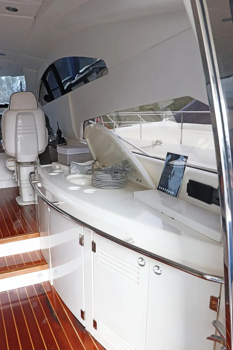 Slide: The Image of Ladder on a 2000 Sunseeker Predator 74 yacht with wooden steps and metal rails. - 13