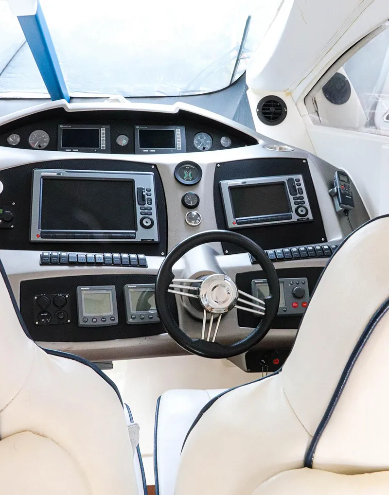 Slide: The Image of Luxury yacht Sunseeker Predator 74, 2000 model, featuring elegant wooden deck table and chairs. - 18