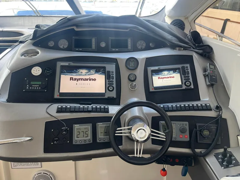 Slide: The Image of Sunseeker Predator 74 yacht interior with wooden table and cushioned seating, 2000 model. - 19