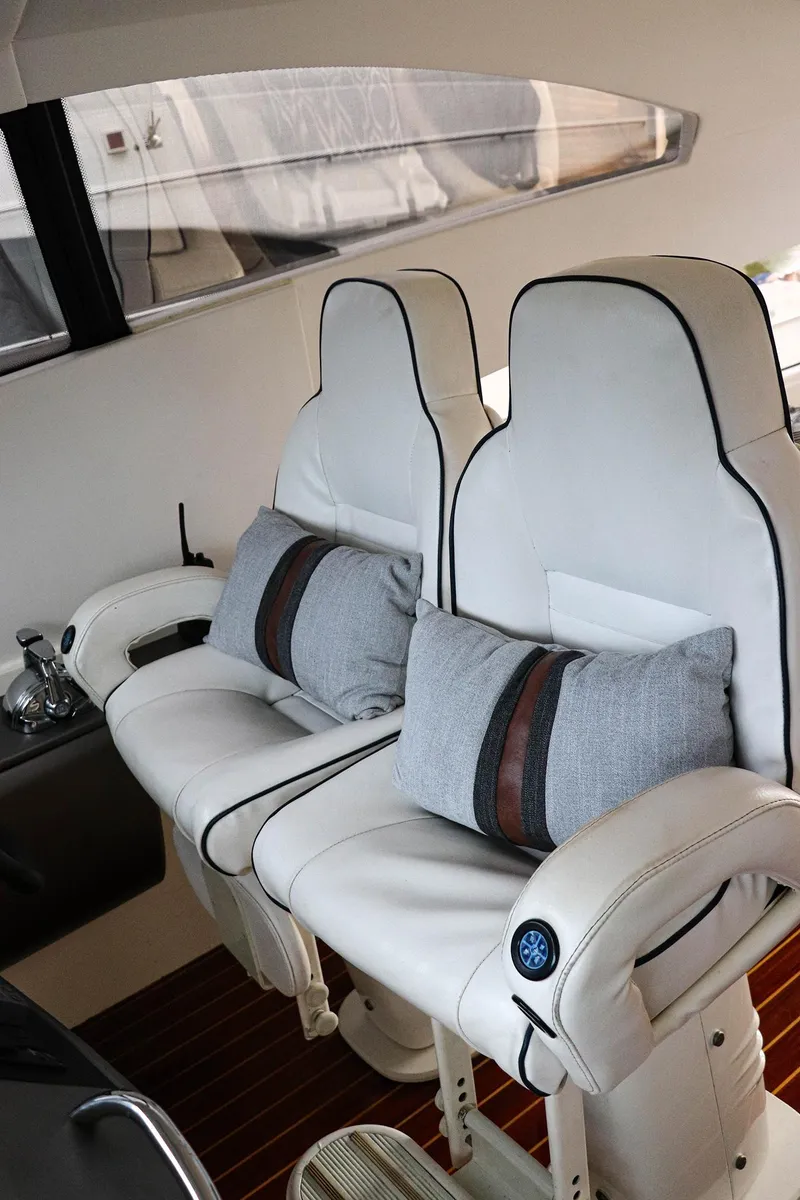 Slide: The Image of Luxurious Sunseeker Predator 74 yacht interior with elegant seating and wooden table, 2000 model. - 22