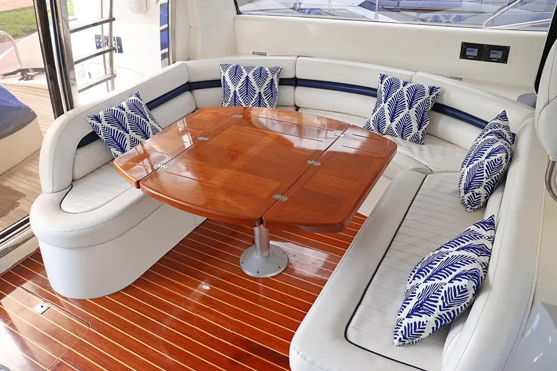 Slide: The Image of Luxurious interior of 2000 Sunseeker Predator 74 yacht with plush seating and striped cushions. - 25