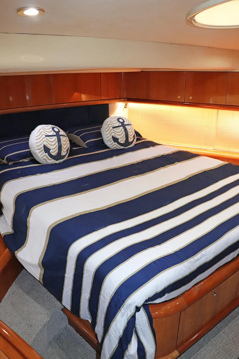 Slide: The Image of Luxurious interior of a 2000 Sunseeker Predator 74 yacht with elegant seating and wooden finishes. - 38