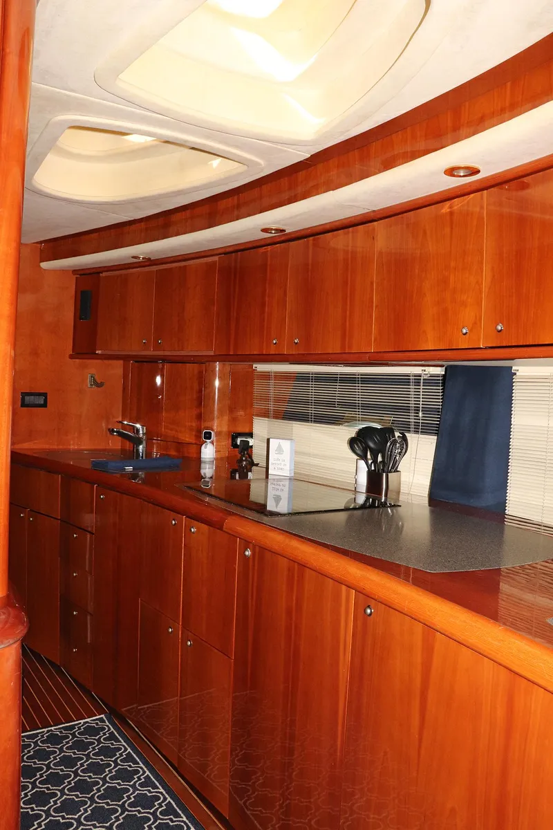 Slide: The Image of Interior of 2000 Sunseeker Predator 74 yacht with wooden cabinetry and minibar. - 41