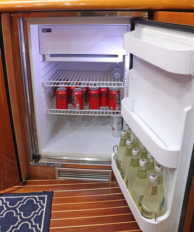 Slide: The Image of Luxurious kitchen interior of 2000 Sunseeker Predator 74 yacht with wooden cabinetry. - 42