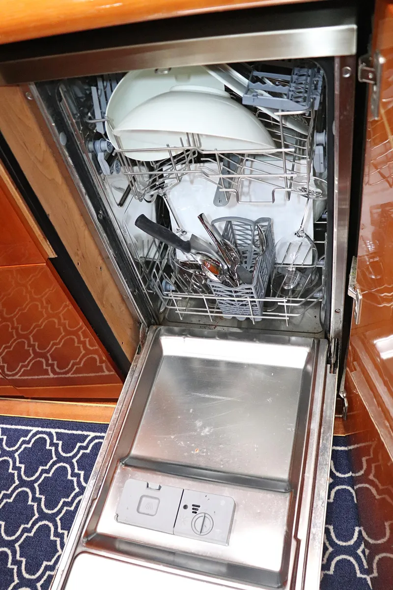 Slide: The Image of Sunseeker Predator 74 yacht interior, featuring wooden cabinetry and flooring, 2000 model. - 44