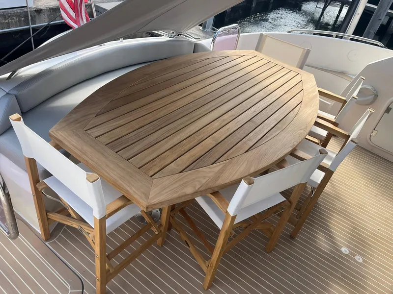 Slide: The Image of Sunseeker Predator 74 yacht docked at marina, clear sky, 2000 model. - 5