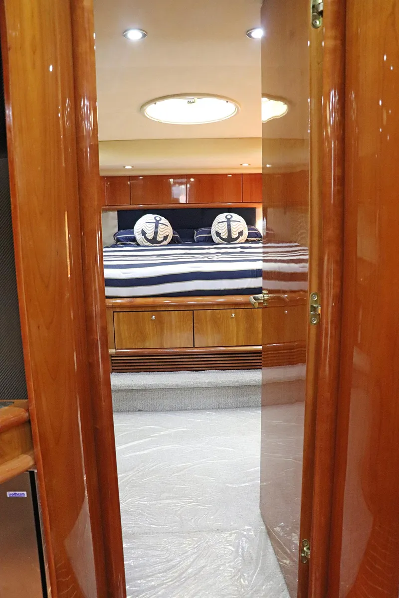 Slide: The Image of Open fridge on Sunseeker Predator 74 yacht, stocked with drinks and water bottles. - 50
