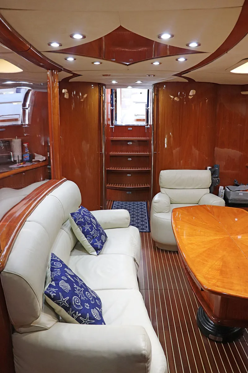 Slide: The Image of Control panel of a 2000 Sunseeker Predator 74 yacht, featuring switches and digital displays. - 52