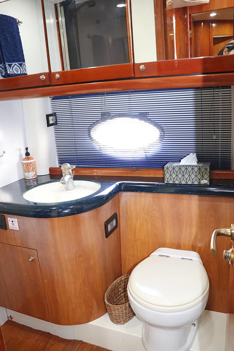 Slide: The Image of Bunk beds with blue bedding in a 2000 Sunseeker Predator 74 yacht cabin. - 67