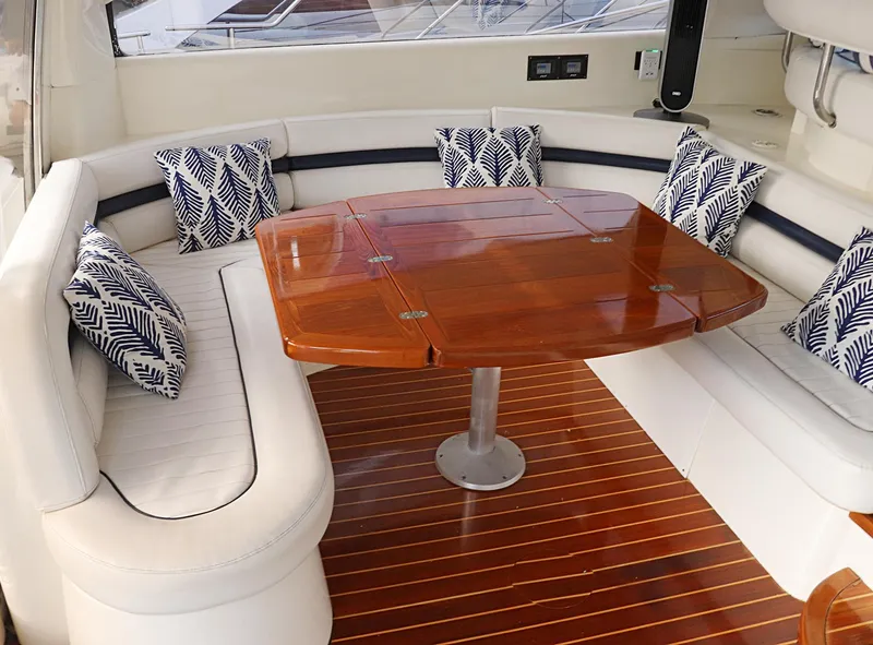 Slide: The Image of Sunseeker Predator 74 yacht, 2000 model, docked at marina with open sunshade. - 7