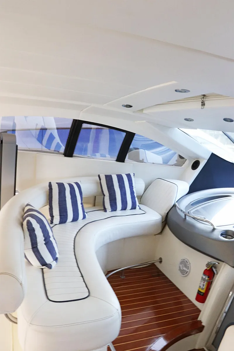 Slide: The Image of Sunseeker Predator 74 yacht bow view, docked in a marina, 2000 model. - 8