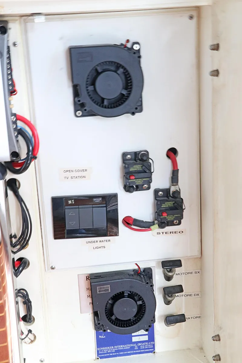 Slide: The Image of Sunseeker Predator 74 yacht, 2000 model, docked with palm trees in the background. - 9