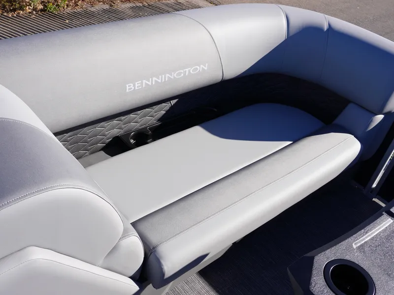 Slide: The Image of 2025 Bennington 20 SSB boat seating with gray upholstery and logo. - 13