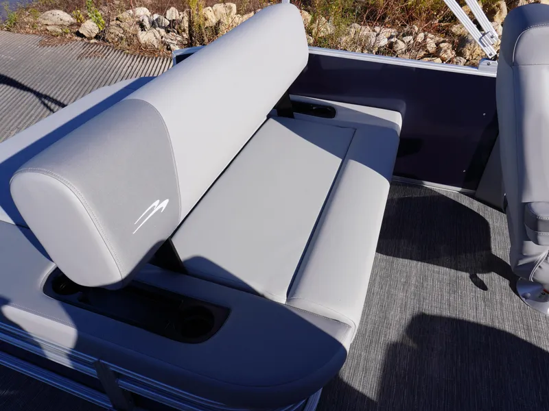 Slide: The Image of 2025 Bennington 20 SSB boat seat with gray upholstery and cup holders. - 19