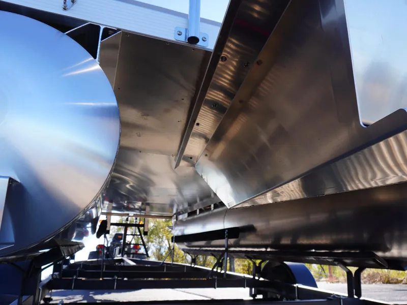 Slide: The Image of Underneath view of a 2025 Bennington 20 SSB pontoon boat, showcasing sleek aluminum construction. - 21