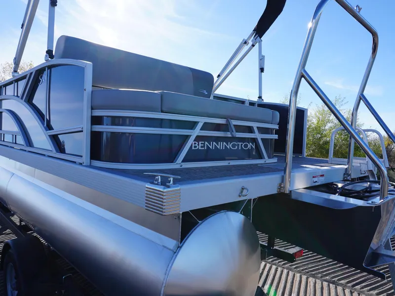 Slide: The Image of 2025 Bennington 20 SSB pontoon boat with sleek design and modern features. - 4