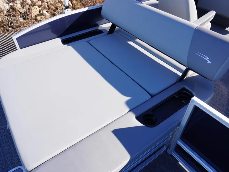 Slide: The Image of 2025 Bennington 20 SSB boat interior with gray seating and cup holders. - 5