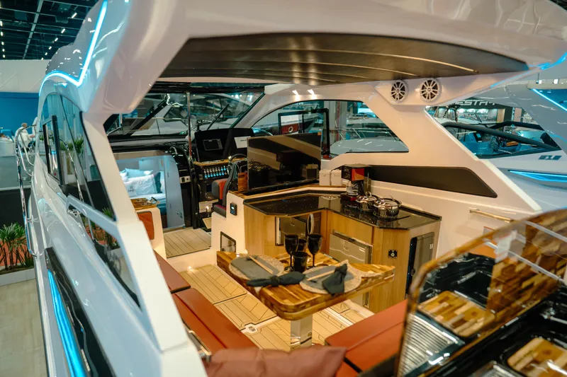 Slide: The Image of Luxurious interior of 2025 NHD 365 HT PLUS yacht with modern kitchen and seating area. - 10