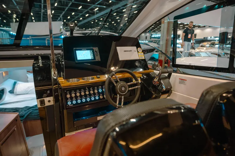 Slide: The Image of Interior view of 2025 NHD 365 HT PLUS yacht cockpit with modern controls and seating. - 18
