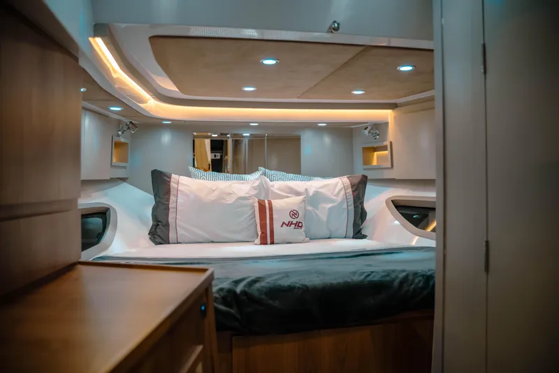 Slide: The Image of Luxurious interior of 2025 NHD 365 HT PLUS yacht with cozy bedding and ambient lighting. - 28