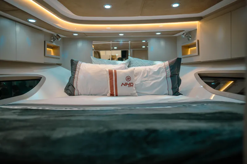 Slide: The Image of Luxurious interior of 2025 NHD 365 HT PLUS yacht with elegant bedding and ambient lighting. - 31