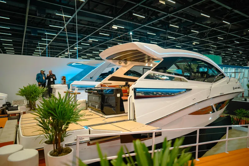 Slide: The Image of 2025 NHD 365 HT PLUS yacht displayed at a boat show, featuring sleek design and modern amenities. - 4