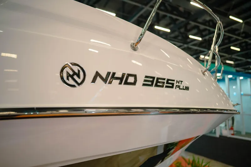 Slide: The Image of 2025 NHD 365 HT PLUS boat showcased at an indoor exhibition. - 5