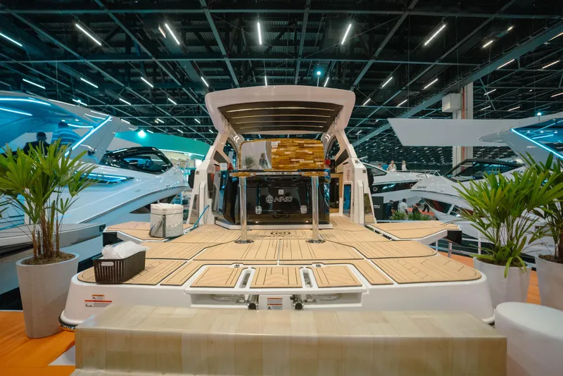 Slide: The Image of Luxury NHD 365 HT PLUS yacht displayed at a boat show, 2025 model. - 7