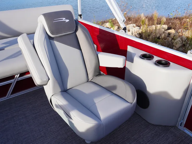 Slide: The Image of Luxury seating on 2025 Bennington 22 SVSB boat, featuring gray upholstery and cup holders. - 11