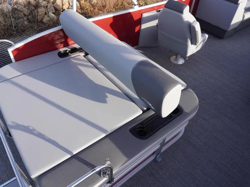 Slide: The Image of 2025 Bennington 22 SVSB boat interior with gray seating and red accents. - 22
