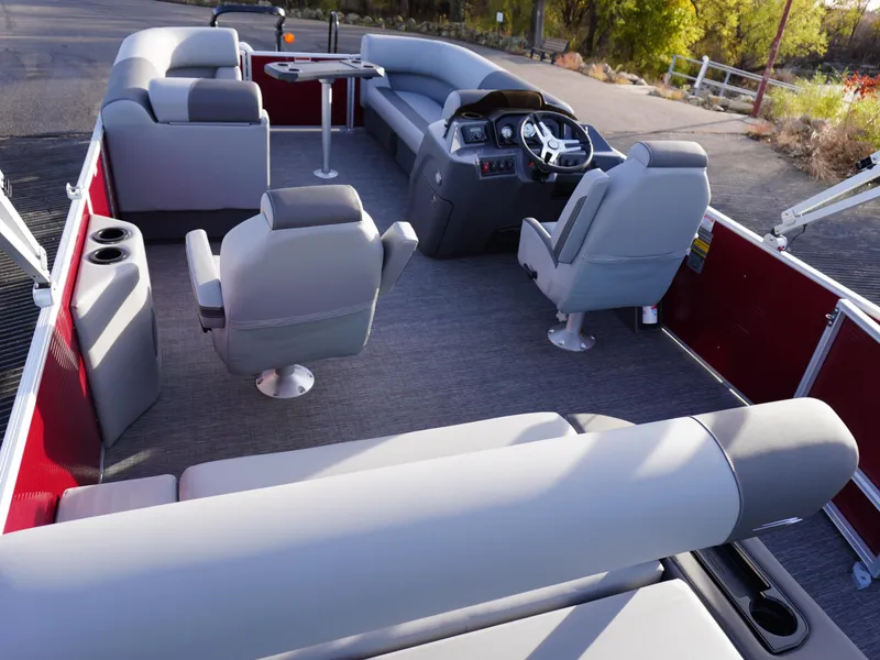 Slide: The Image of 2025 Bennington 22 SVSB pontoon boat interior with plush seating and modern helm. - 23
