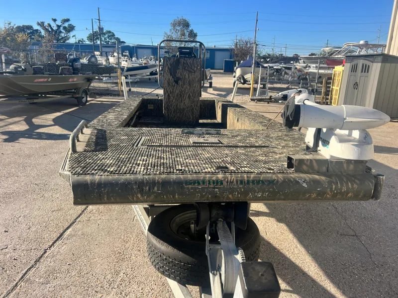 Slide: The Image of 2015 Gator Trax 18 boat on trailer in outdoor storage area. - 6