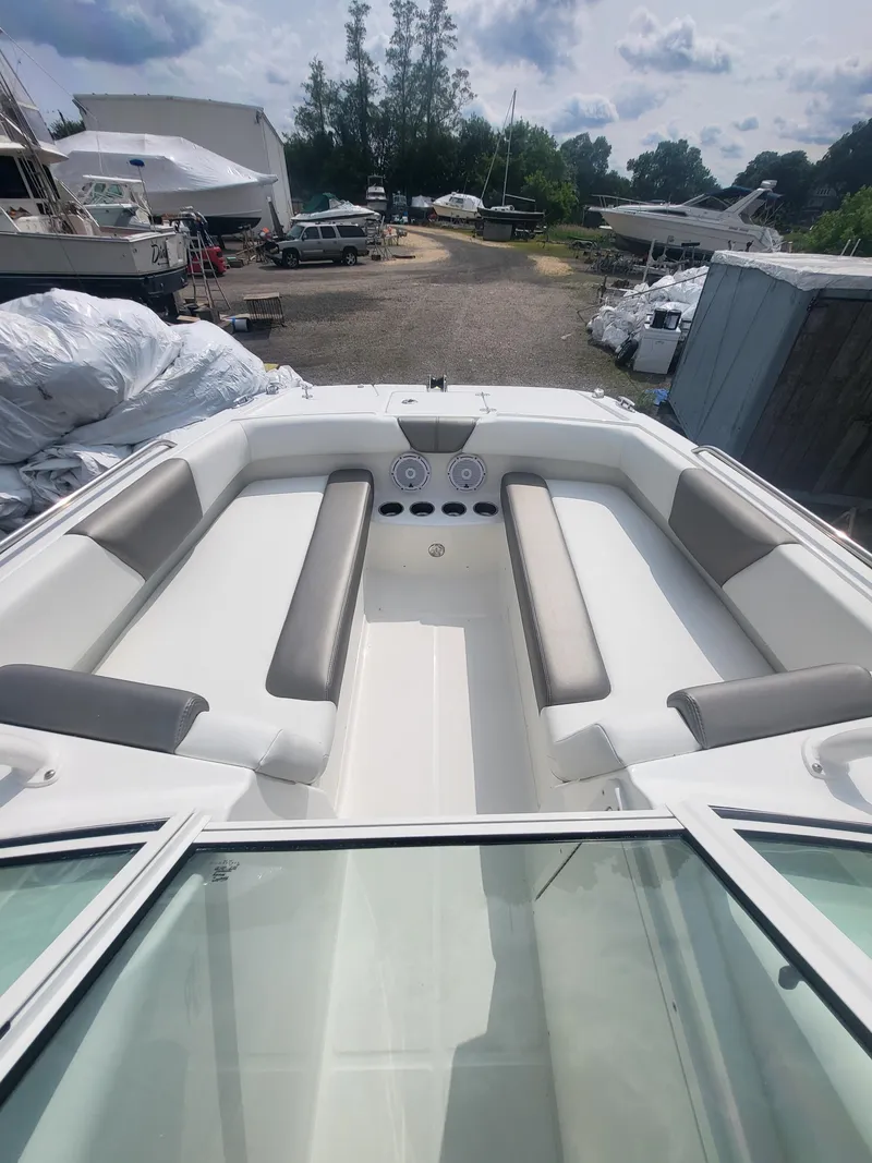 Slide: The Image of 2024 World Cat 230 SD boat interior with spacious seating and modern design. - 2