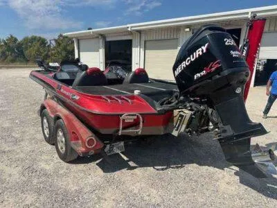 Slide: The Image of 2007 Ranger Z21 Comanche boat with Mercury Pro XS engine in a parking area. - 3