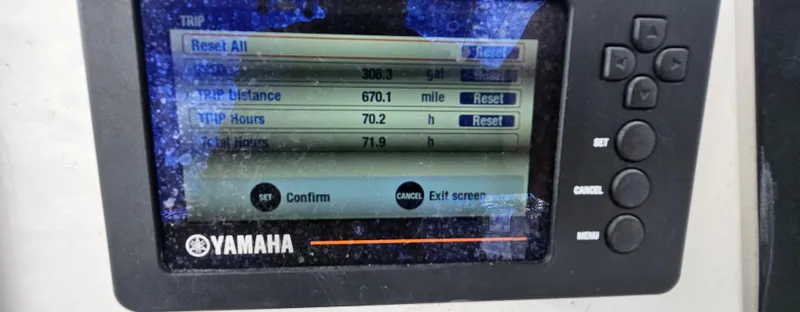 Slide: The Image of Yamaha display showing trip data on a 2018 Robalo 246 Cayman boat. - 18