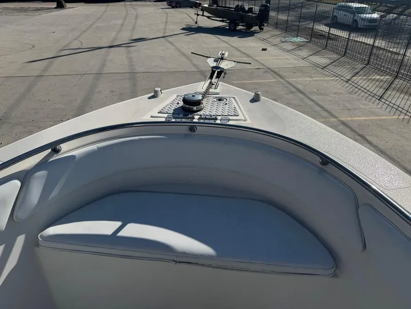 Slide: The Image of 2005 Sea Chaser 2600 CC boat bow with seating and anchor, parked on concrete. - 6